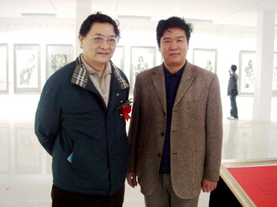 著名画家谭连华与郭怡宗先生合影