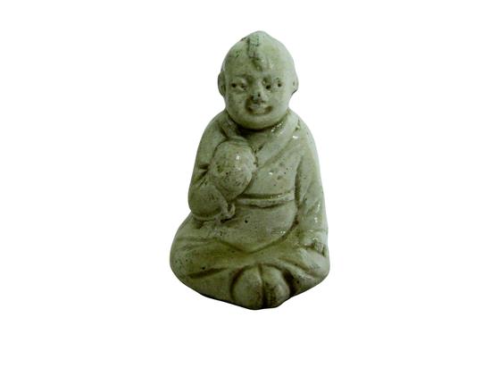宋代定窑童子坐像赏析
